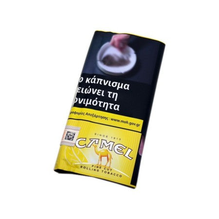 A Camel rolling tobacco packet with Greek warning text, featuring a black upper section and a yellow lower section with the Camel logo, shown on a plain white background.