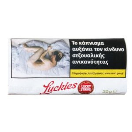 A pack of Luckyies Lucky Strike cigarettes on a plain white background. The packaging features a prominent health warning graphic with a photo of a couple in bed and Greek text, along with the red Luckyies brand logo and a red Lucky Strike seal.