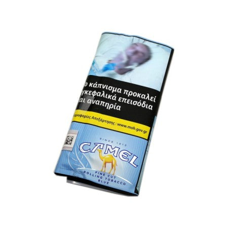 A pack of Camel rolling tobacco, specifically 'Blue' flavor, shown at an angle on a plain white background. The packaging features a light blue background with a yellow camel logo and a prominent black warning label with Greek text.