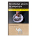 A rectangular product package or book-style cover with Greek text at the top, a photo of a hand placing a cigarette into an ashtray in the center, and a beige lower section labeled 'Essential Brown' with a white camel silhouette. The product is shown against a plain white background.